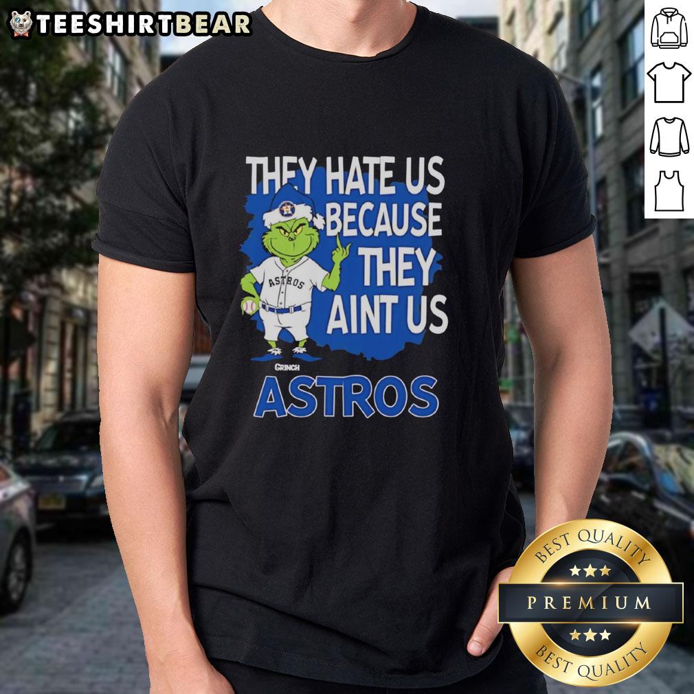 Top Houston Astros Grinch Christmas T-Shirt featuring 'They Hate Us Ain't Us' design, perfect for holiday cheer.