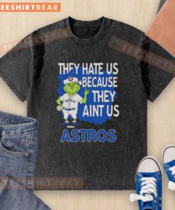 Top Houston Astros Grinch Christmas T-shirt with 'They Hate Us, Ain't Us' design for festive fans.