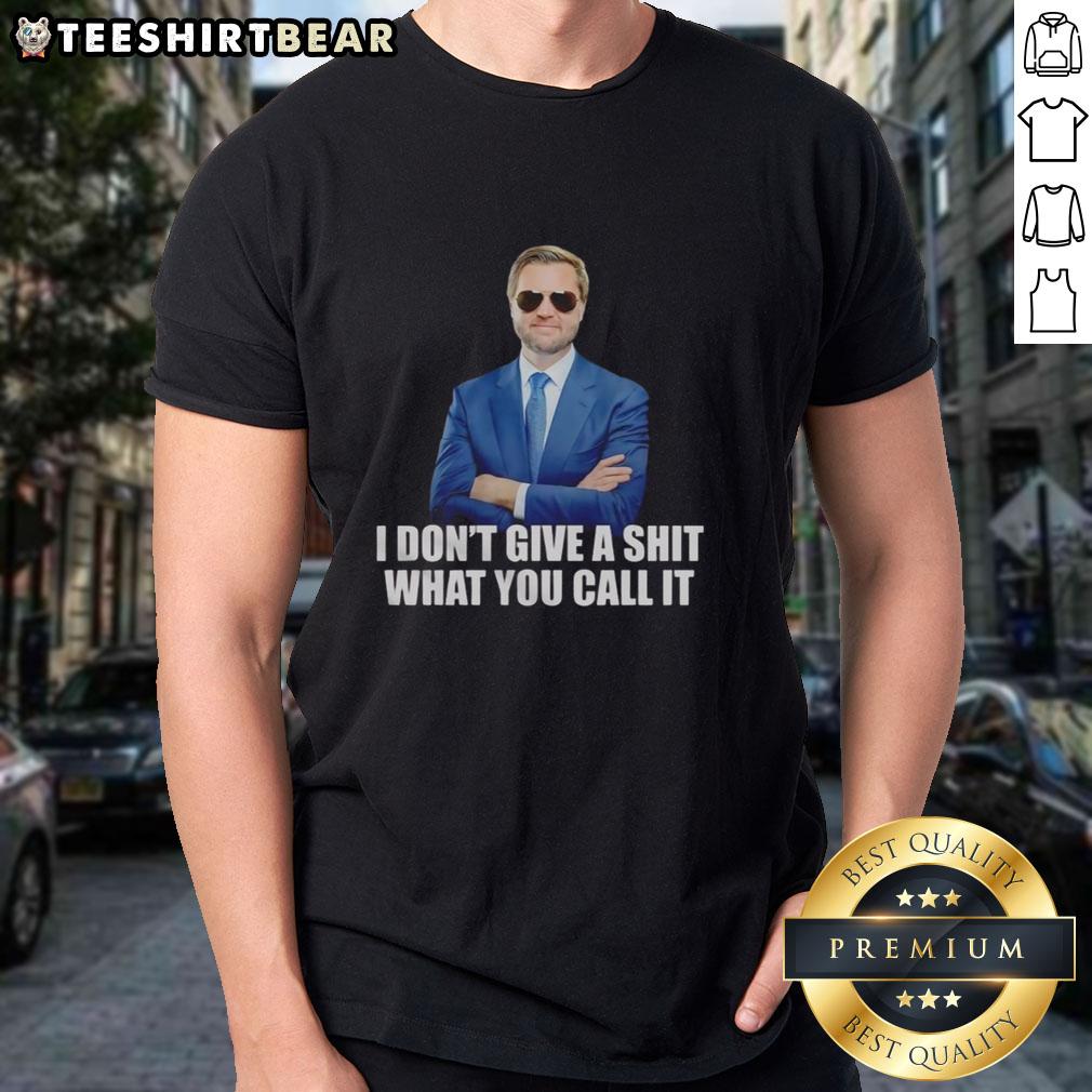 Alt Text: Top J.D. Vance 'I Don't Give A Shit What You Call It' T-Shirt showcasing bold graphic design and casual style.