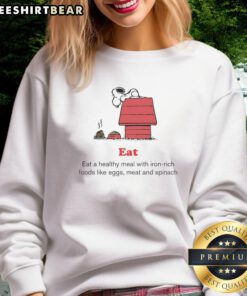 Top Peanuts x American Red Cross sweatshirt promoting healthy meals with iron-rich foods like eggs, meat, and spinach.