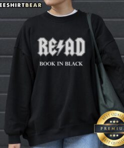 Top READ book in a stylish black X ACDC sweatshirt, perfect for music lovers and readers alike.