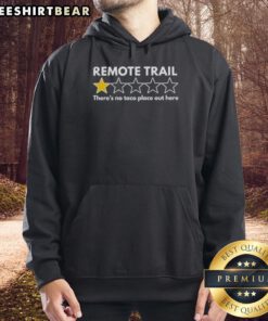 Person wearing 'Top Remote Trail One Star There's No Taco Place Out Here' hoodie in a scenic outdoor trail setting.
