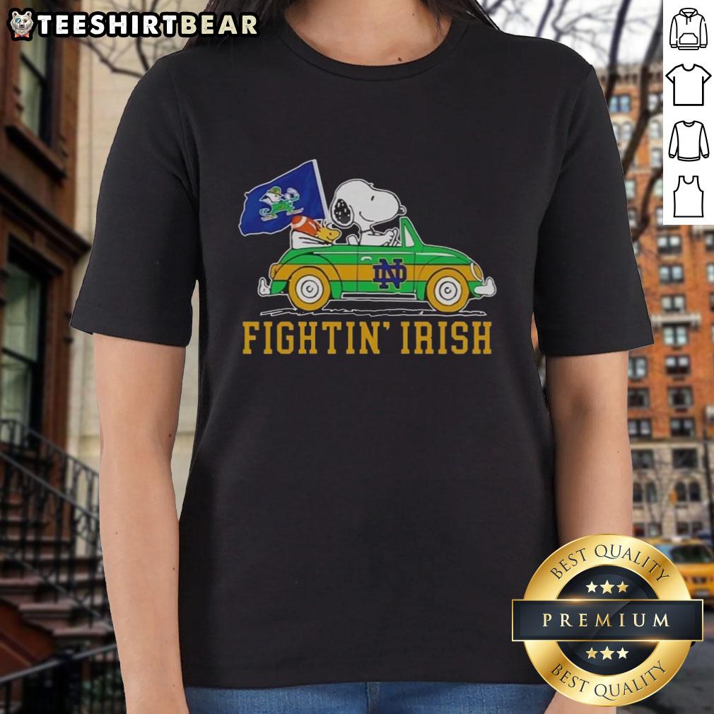 Alt Text: Snoopy and Woodstock driving a car on a Notre Dame Fighting Irish ladies tee, showcasing vibrant team spirit.
