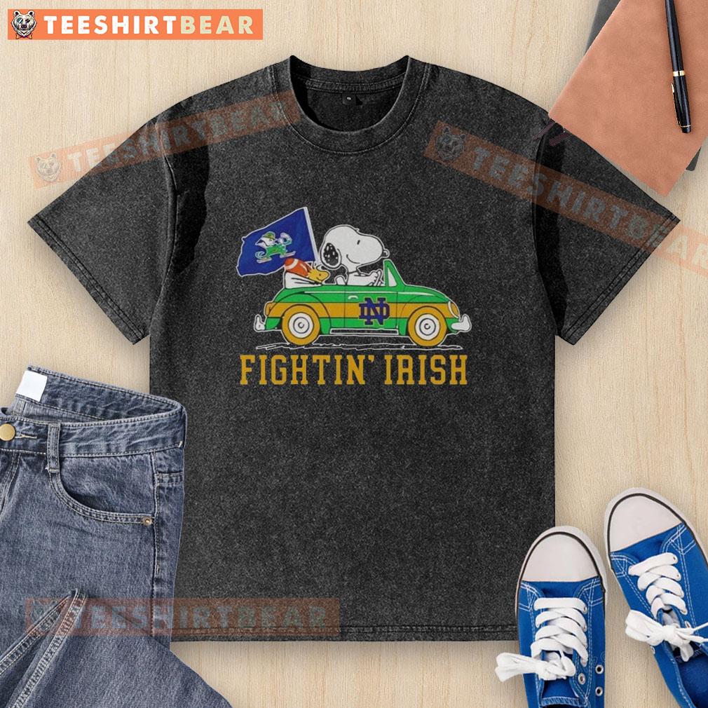 Top Snoopy and Woodstock driving a car on a Notre Dame Fighting Irish washed t-shirt design.