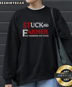 Farmer wearing 'No Farmers, No Food' sweatshirt, showcasing dedication to agriculture and farming culture.