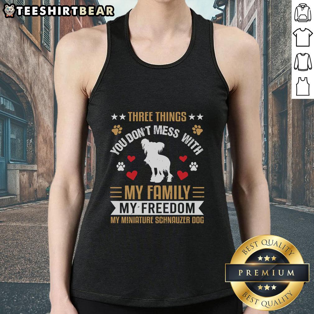 Alt Text: Awesome tank top featuring 'Three Things You Don't Mess With: My Family, My Freedom, My Miniature Schnauzer' design.