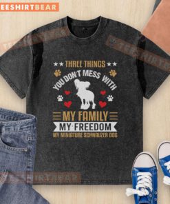 Washed t-shirt featuring 'Three Things You Don't Mess With: My Family, My Freedom, My Miniature Schnauzer Dog' design.