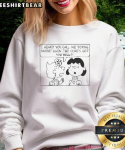 Cute Peanuts characters on a sweatshirt with 'I Heard You Call Me Boring Barbie' text, perfect for cozy outfits.
