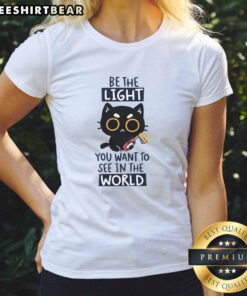 Funny cat graphic on a ladies' tee with the quote Be the light you want to see in the world for cat lovers.