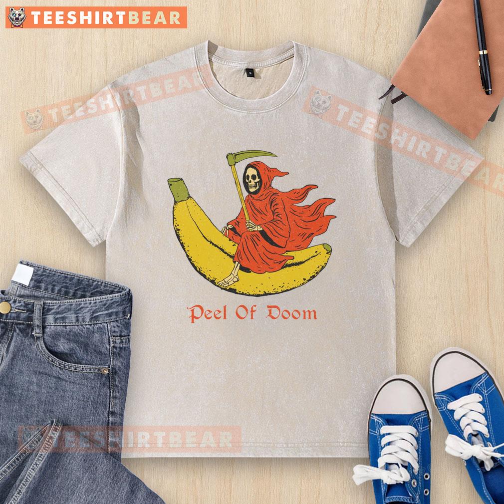 Funny The Reaper Banana Peel of Doom washed t-shirt featuring a humorous graphic design of a grim reaper slipping on a banana peel.