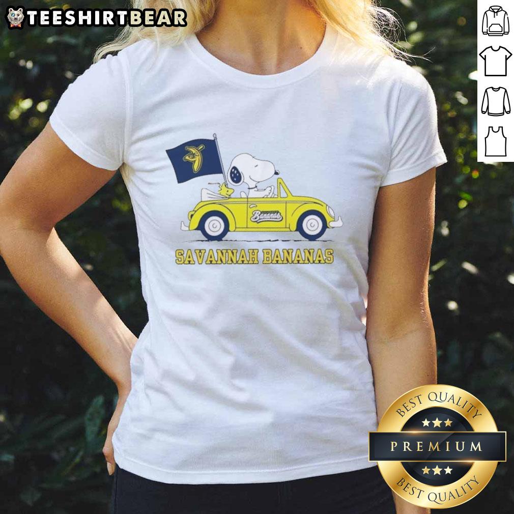 Snoopy driving a car in a Savannah Bananas ladies tee, showcasing fun and sporty style for fans.