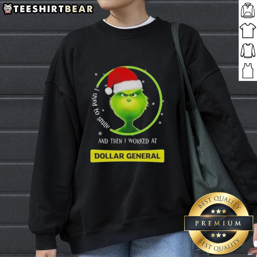 Funny sweatshirt featuring a Grinch design with the phrase 'I Used To Smile And Then I Worked At Dollar General.'