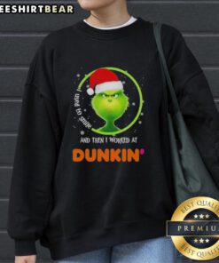 Cozy sweatshirt featuring a Grinch graphic with 'I Used to Smile and Then I Worked at Dunkin' Donuts' text.