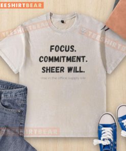 Official Focus Commitment Sheer Will Me in the Office Supply Isle washed t-shirt displayed on a hanger in a bright store.