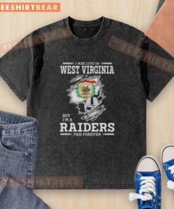 Washed t-shirt featuring 'I May Live In West Virginia But I'm A Raiders Fan Forever' design, perfect for Raiders fans.