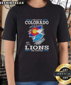 Premium ladies tee featuring 'I May Live In Colorado But I'm A Lions Fan Forever' design for passionate fans.