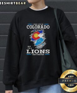 Premium sweatshirt with 'I May Live In Colorado But I'm A Lions Fan Forever' design, perfect for Lions fans.