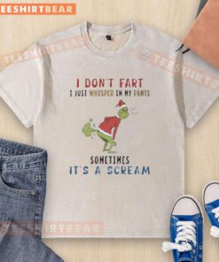 Premium The Grinch 'I Don't Fart, I Just Whisper' T-Shirt in a casual setting, showcasing fun holiday humor.