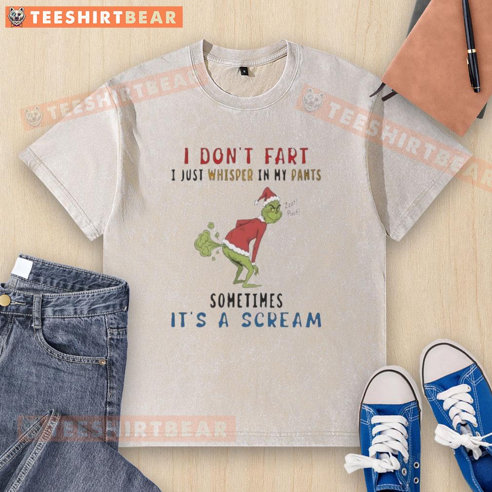 Premium The Grinch 'I Don't Fart, I Just Whisper' T-Shirt in a casual setting, showcasing fun holiday humor.