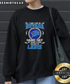 Alt Text: Cozy sweatshirt with I May Live In Nevada, But My Heart Belongs To Detroit Lions design, perfect for game day.