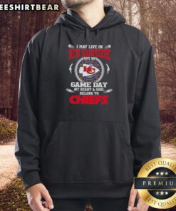 Alt Text: Woman wearing a Kansas City Chiefs hoodie, showcasing team spirit while living in New Hampshire on game day.