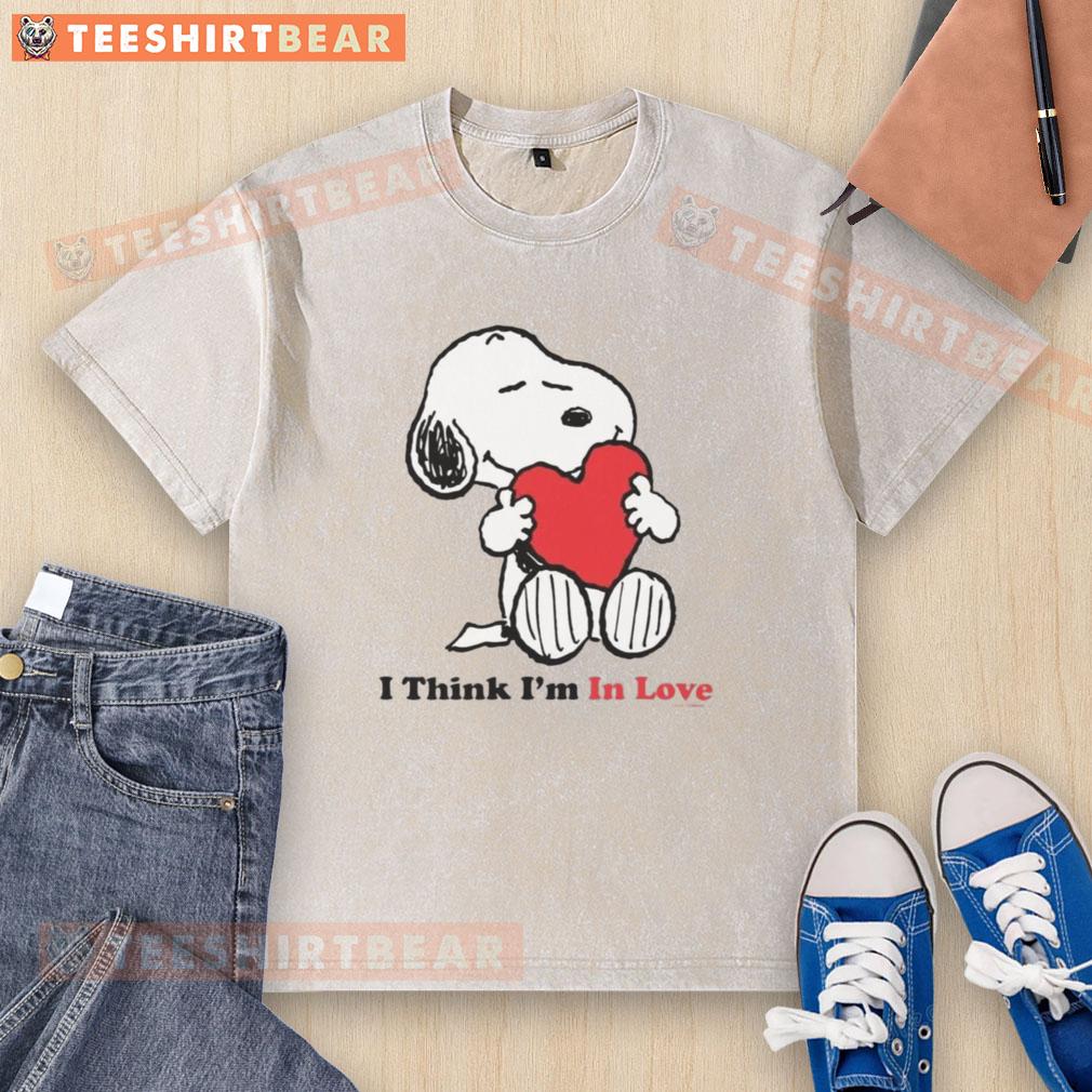 Pretty Snoopy 'I Think I'm In Love' washed t-shirt featuring a cute Snoopy graphic on a soft, casual tee.