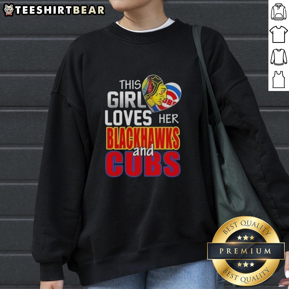 Girl in a Chicago sports sweatshirt, showcasing her love for Blackhawks and Cubs at a game in Chicago.