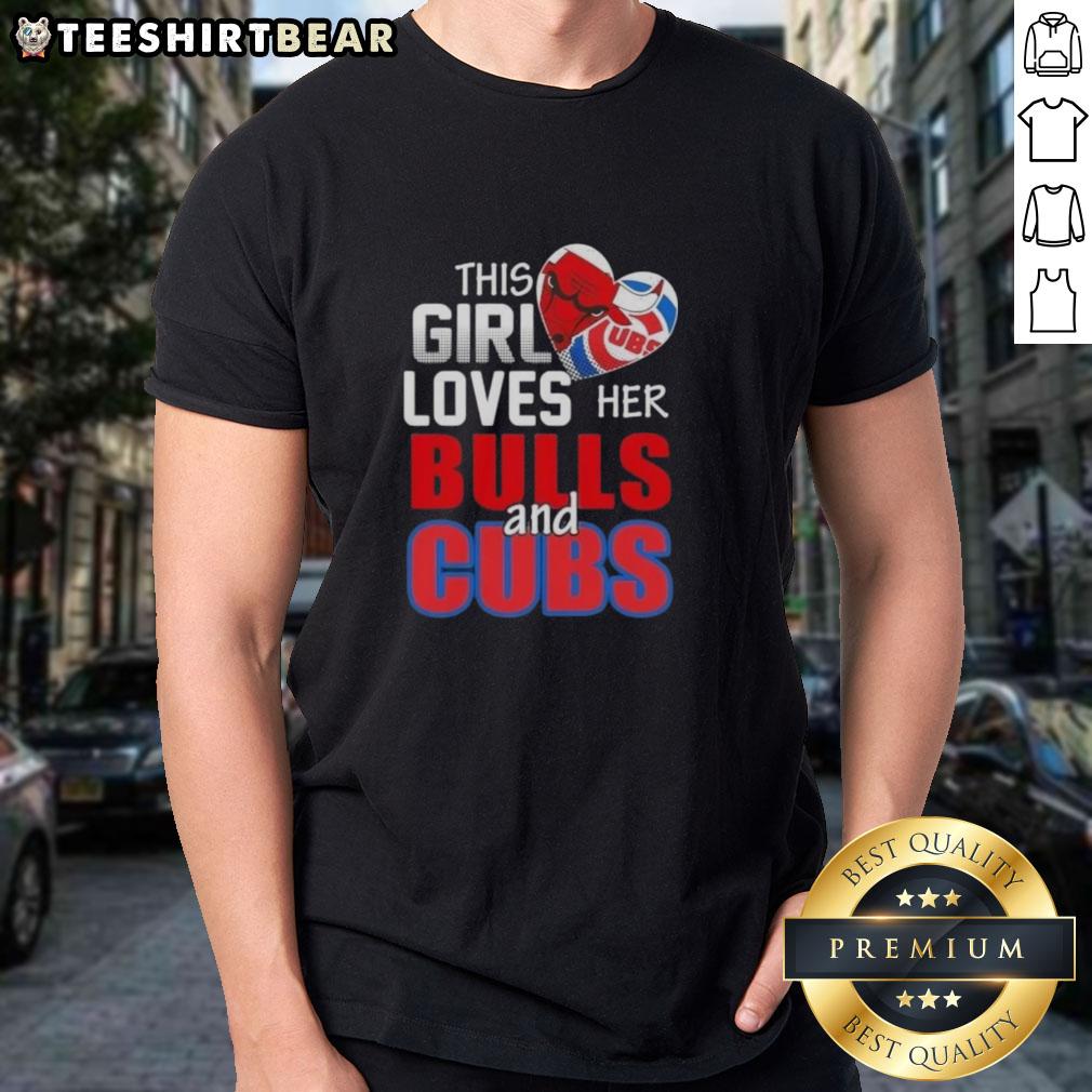 Girl wearing 'Top This' Chicago sports T-shirt, showing love for Bulls and Cubs, smiling in vibrant city setting.