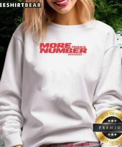 2025 MotoGP World Champion Marc Marquez wearing a stylish sweatshirt with 'More Than A Number' graphic.