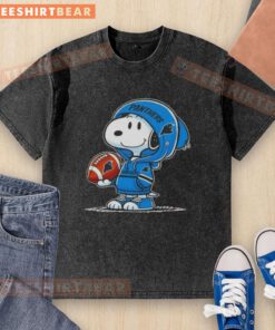Premium Peanuts Snoopy in a Carolina Panthers hoodie smiles at fans on a washed t-shirt, showcasing playful team spirit.