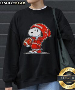 Premium Peanuts Snoopy wearing a Cleveland Browns hoodie, smiling at fans in a cozy sweatshirt.