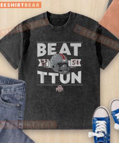 Ohio State Buckeyes football fans celebrate victory over TTUN in 2025, wearing washed t-shirts in team colors.
