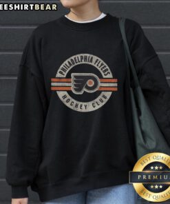 Vintage Philadelphia Flyers sweatshirt featuring a classic surround design, perfect for sports fans and collectors.