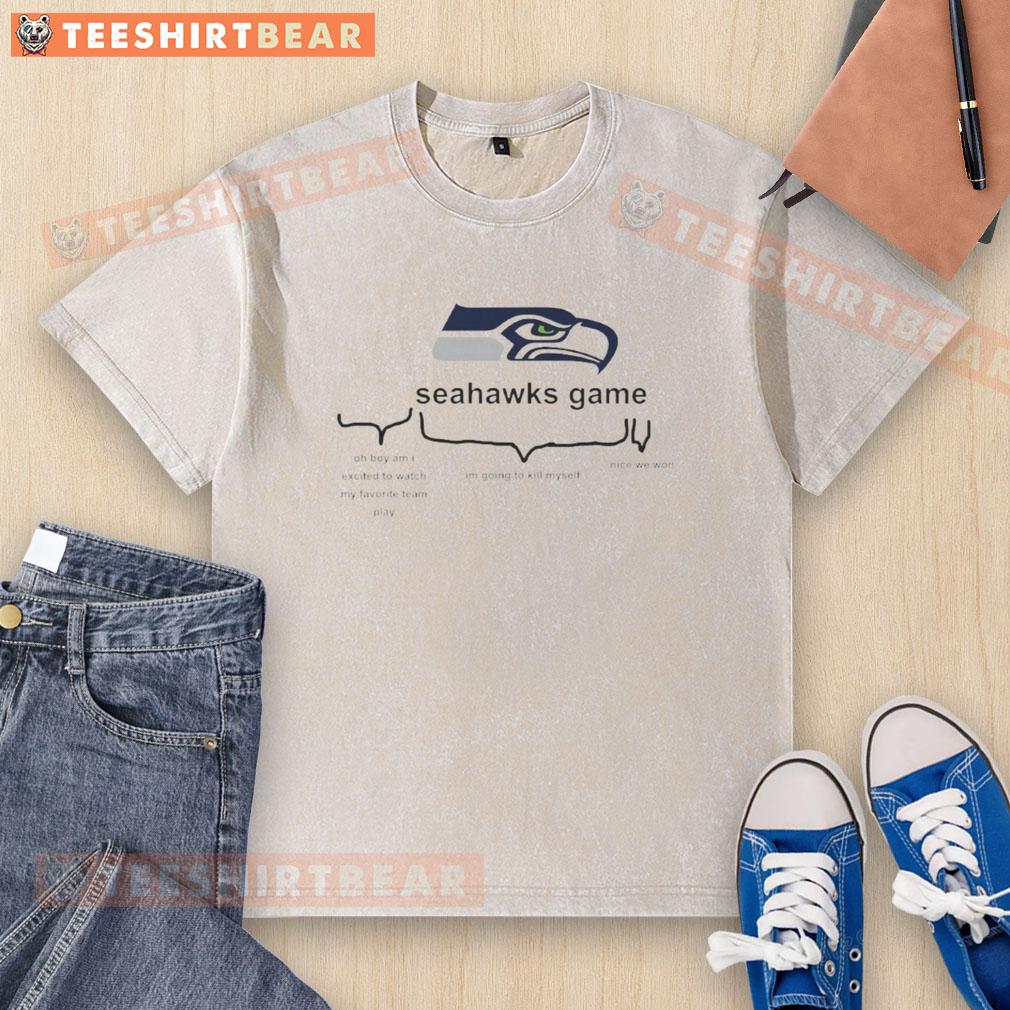 Excited fans wearing Seattle Seahawks gear celebrate victory in a washed t-shirt after an awesome game.