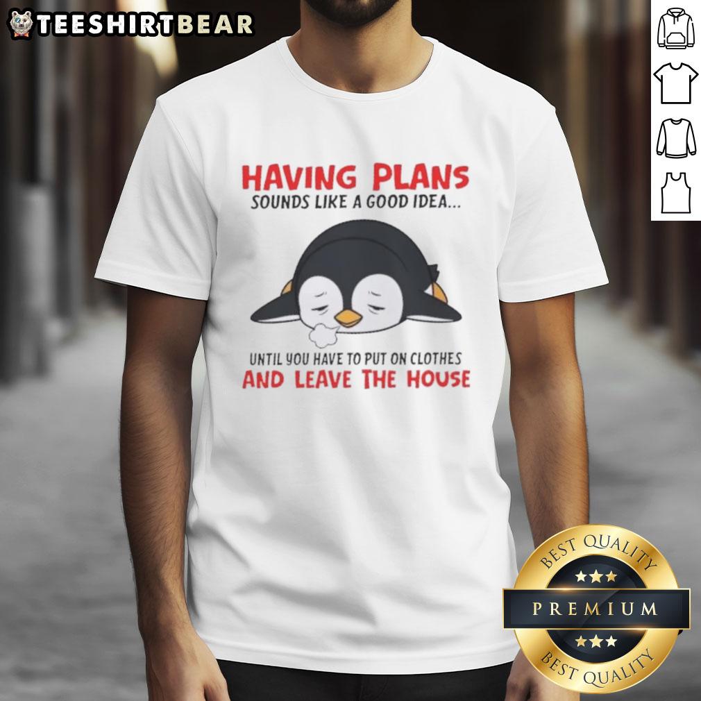 Alt Text: Cute penguin graphic on a T-shirt with the phrase about plans, humorously highlighting reluctance to leave the house.