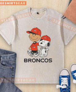Good Denver Broncos NFL X Peanuts Snoopy and Charlie Brown washed t-shirt featuring vibrant team colors and playful design.