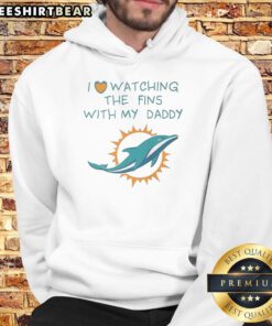 Father and child enjoying a Miami Dolphins game together, both wearing 'Good Miami Dolphins' hoodies, showcasing team pride.