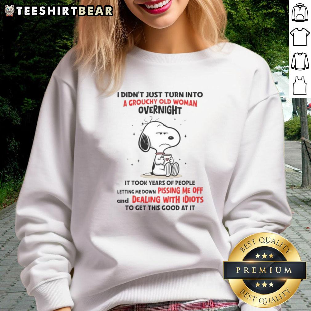 Alt Text: Good Snoopy sweatshirt featuring a humorous quote about aging, perfect for fans of vintage cartoon apparel.