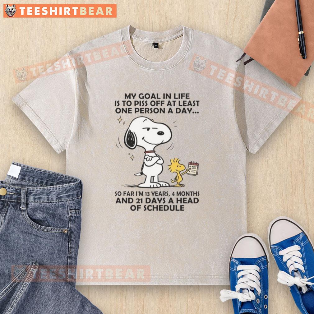 Good Snoopy t-shirt with the quote 'My goal in life is to piss off at least one person a day' in vibrant colors.