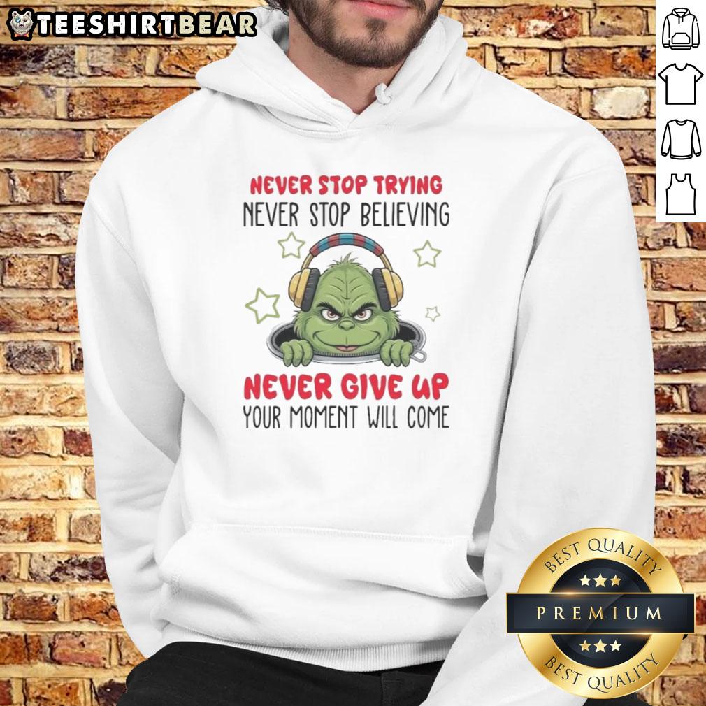 Cozy Nice Grinch hoodie with 'Never Stop Trying, Never Stop Believing' design in festive green and red colors.