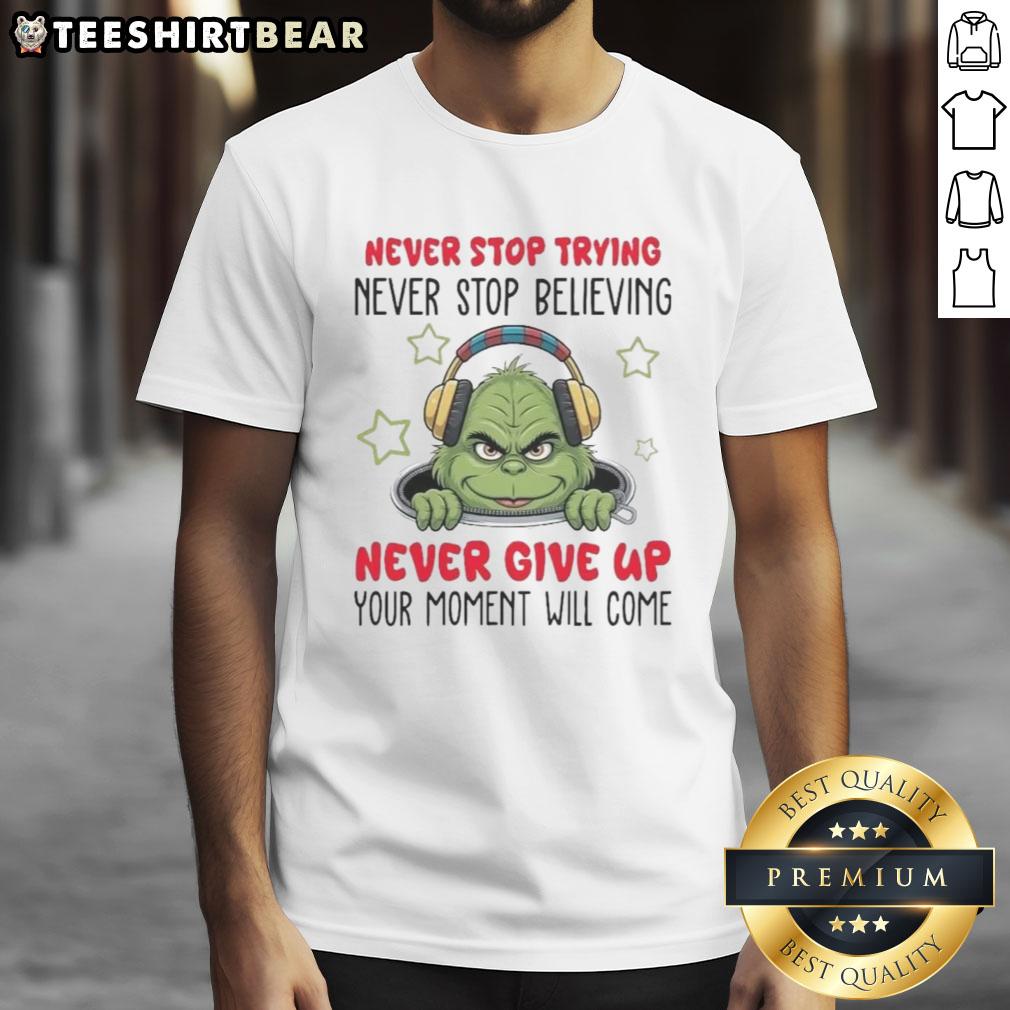 Nice Grinch Never Stop Trying Never Stop Believing T-Shirt featuring a festive design and motivational text.