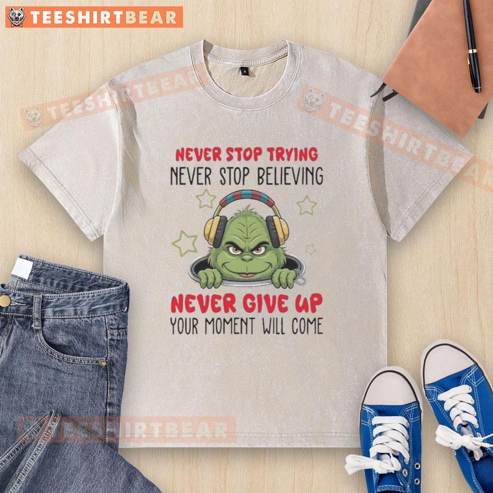 Alt Text: Nice Grinch Never Stop Trying Never Stop Believing washed t-shirt featuring a festive Grinch design and motivational text.