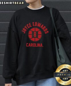 Alt Text: Joyce Edwards poses in a stylish sweatshirt representing Nice South Carolina Basketball, showcasing team spirit.