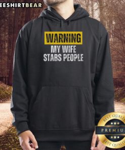 Vintage hoodie with 'Nice Warning: My Wife Stabs People' graphic, perfect for humor and unique fashion lovers.