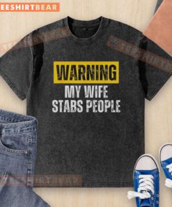 Vintage washed t-shirt featuring a humorous warning 'My Wife Stabs People' design, perfect for casual wear and gifts.