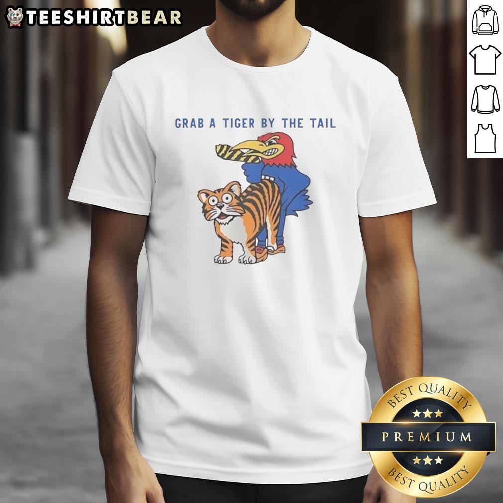 Official Kansas Jayhawks vs Missouri Tigers rivalry T-shirt featuring 'Grab A Tiger By The Tail' mascot design.