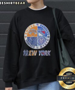 Official New York Knicks, Rangers, Yankees mashup logo sweatshirt showcasing iconic NYC sports team graphics.