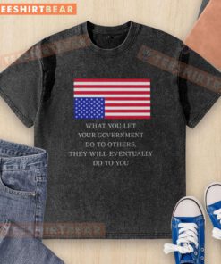 Alt Text: US flag washed t-shirt featuring the quote What You Let Your Government Do To Others, They Will Eventually Do To You.
