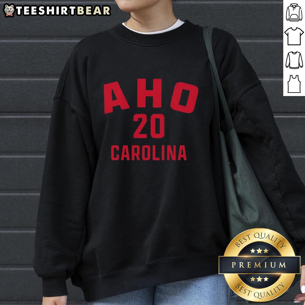 Original Sebastian Aho 20 Carolina Hurricanes hockey sweatshirt featuring team colors and logo, perfect for fans.
