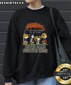Premium Notre Dame Fighting Irish X Peanuts Snoopy sweatshirt showcasing autumn vibes and festive cheer.